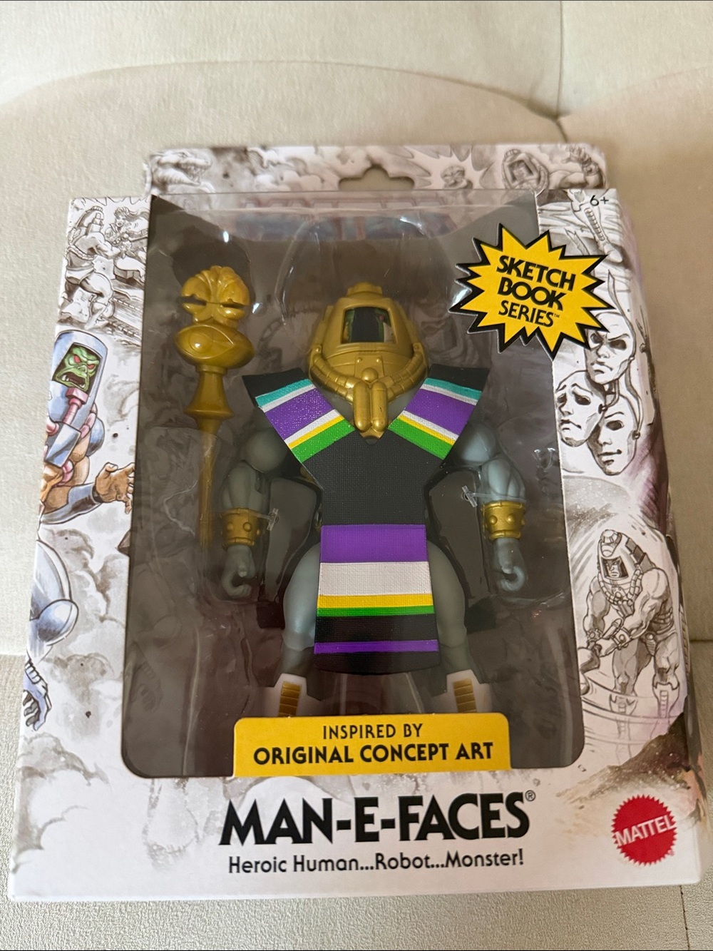 Mattel Man-E-Faces Figure with Gold Helmet and Multi-Striped Sash